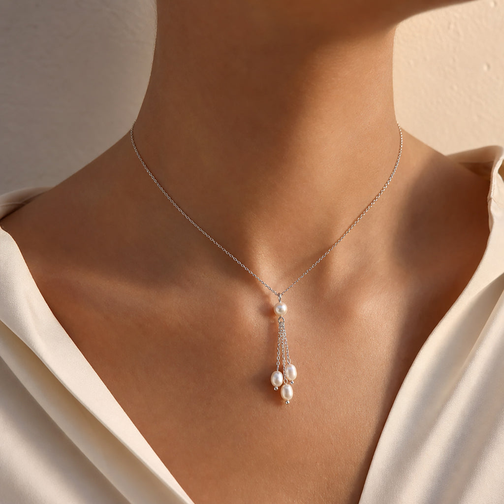 Woman wearing freshwater pearl silver-tone chain necklace