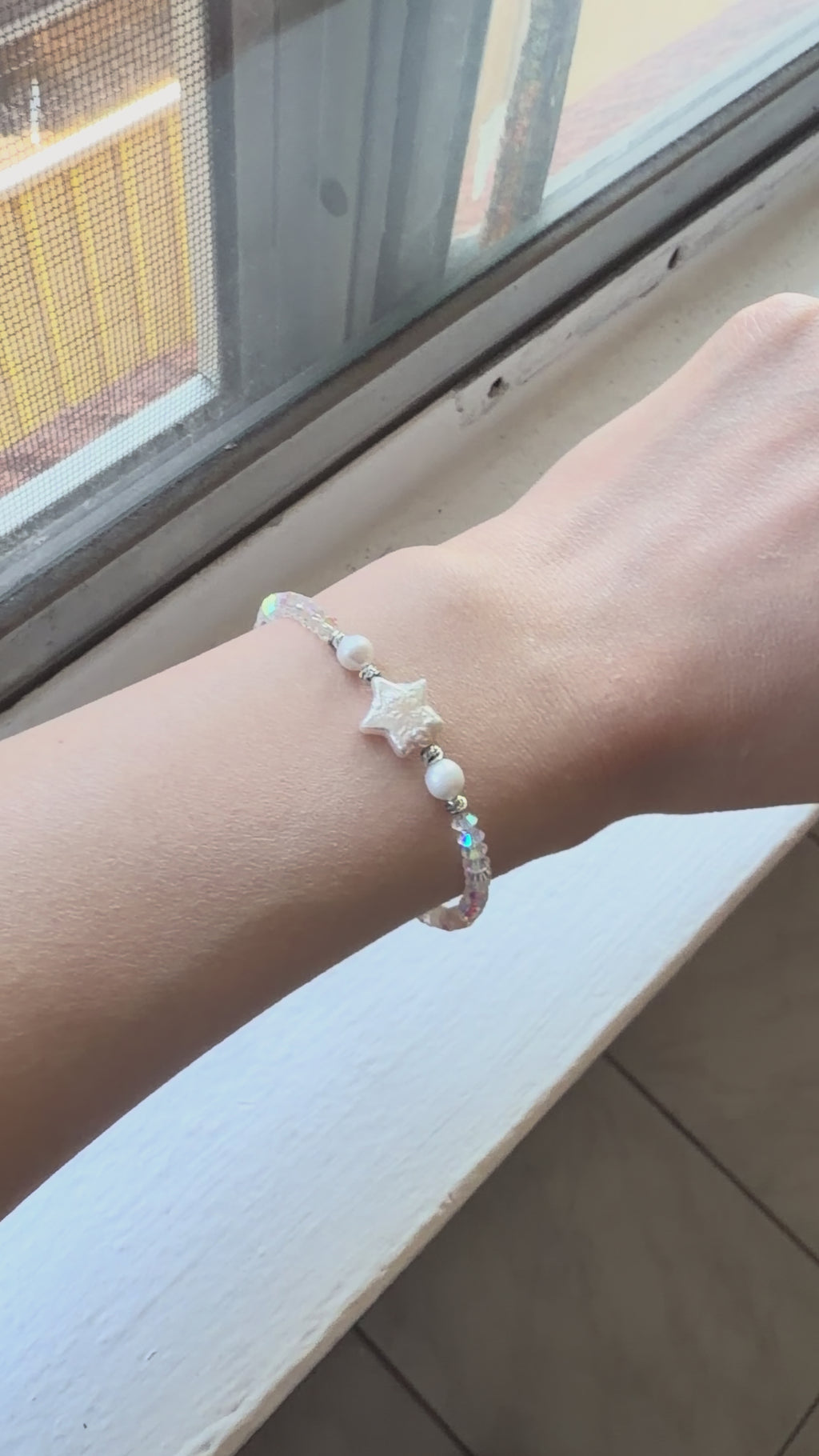 Close-up of natural baroque freshwater pearls held in hand, showing their unique shapes and lustre.
